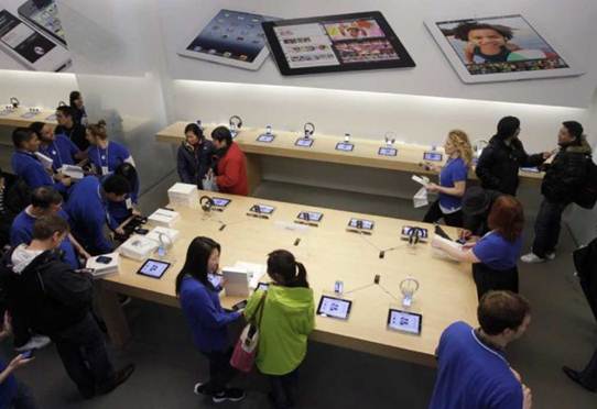 Description: Customers talk with Apple employees